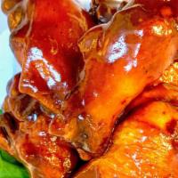 Backyard Bbq Wings · Pluck’d Traditional Texas Mop BBQ sauce, tomato base, a bit of apple cider tang, with a swee...