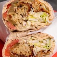 The Cave Steak Wrap · Tender steak served with tomatoes, onions, green pepper, cheddar cheese, rice and your choic...