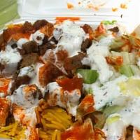 Lamb Gyro · Tender lamb topped with lettuce, tomatoes, onions, and cucumber sauce.