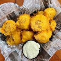 Hand-Battered Mushrooms · Fresh button mushrooms battered and deep-fried, served with a horseradish dipping sauce.