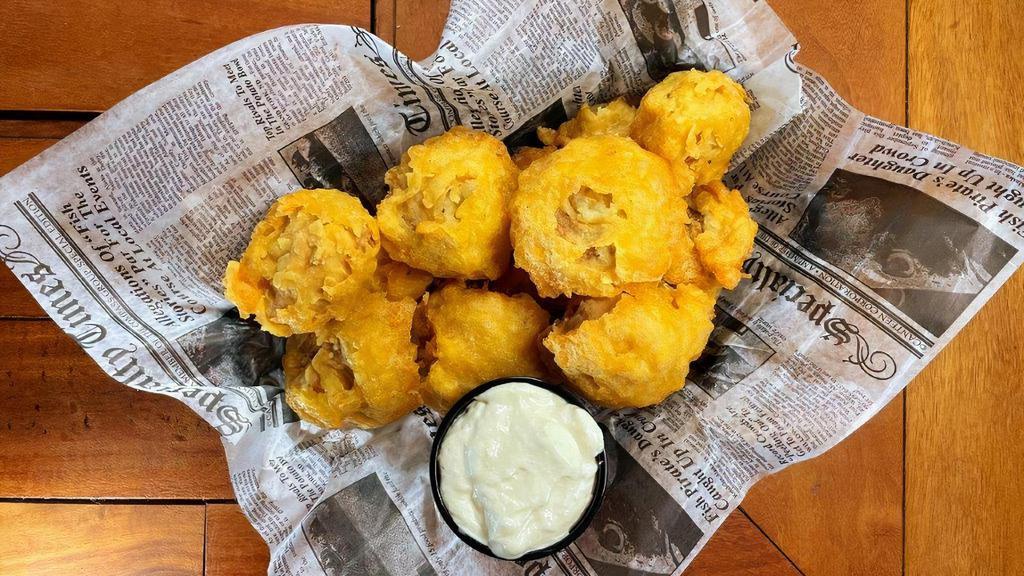 Hand-Battered Mushrooms · Fresh button mushrooms battered and deep-fried, served with a horseradish dipping sauce.
