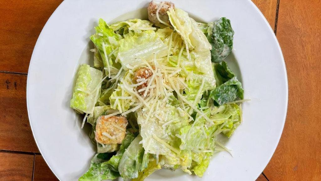 Caesar · Chopped romaine tossed with Parmesan cheese, croutons and caesar dressing.