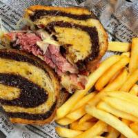 Traditional Reuben · House-made corned beef, swiss cheese, sauerkraut and 1000 island between two slices of grill...