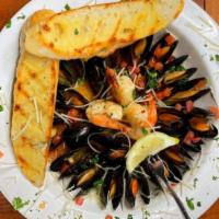 Mussels & Shrimp · Over a pound of mussels with shrimp steamed in white wine, butter and spices. Served with tw...