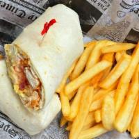 Buffalo Chicken Wrap · Fried chicken tenders dipped in buffalo sauce, shredded cheddar, lettuce, tomato, onion and ...