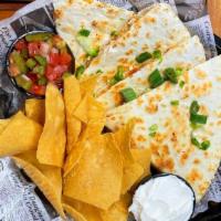 Spicy Chicken Quesadilla · A crispy tortilla stuffed with blackened chicken, house made salsa, monterey jack and chedda...