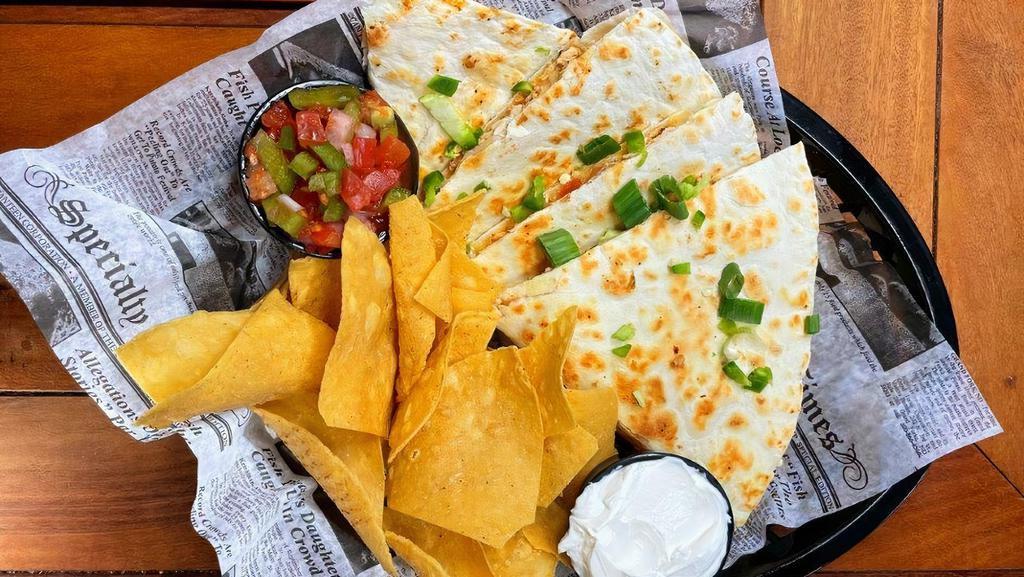 Spicy Chicken Quesadilla · A crispy tortilla stuffed with blackened chicken, house made salsa, monterey jack and cheddar cheese.