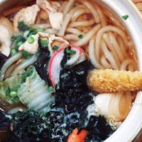Tempura Udon · (buck wheat) udon noodle soup topped with jumbo shrimp tempura, scallions, and seaweed