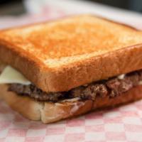Patty Melt · 1/3 LB ALL BEEF PATTY COOKED WITH SLIVERED ONIONS AND MELTED SWISS CHEESE ON TEXAS TOAST
COM...