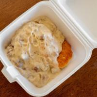 Biscuit & Gravy · Moist fluffy, delicious biscuit topped with creamy sausage gravy