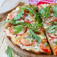 Arugula Pizza (Vegetarian) · Hand rolled pizza dough topped with a layer of mozzarella, shaved parmesan, baby arugula, se...