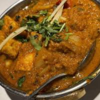 Karahi Bhindi · Okra stir fried with onions, tomatoes, mild spices.