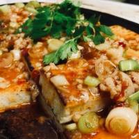 Sizzling Tofu With Pork 铁板豆腐 · Spicy and hot.
