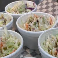 Coleslaw · Shredded red and green cabbage mixed with carrots blended with our creamy, homemade slaw dre...