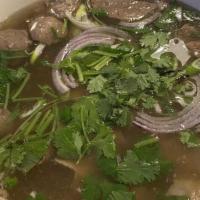 Pho · House special rice noodles beef soup with beef, meatballs and tendons.