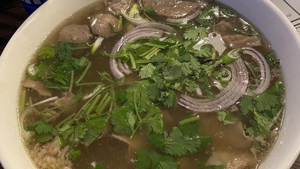 Pho · House special rice noodles beef soup with beef, meatballs and tendons.