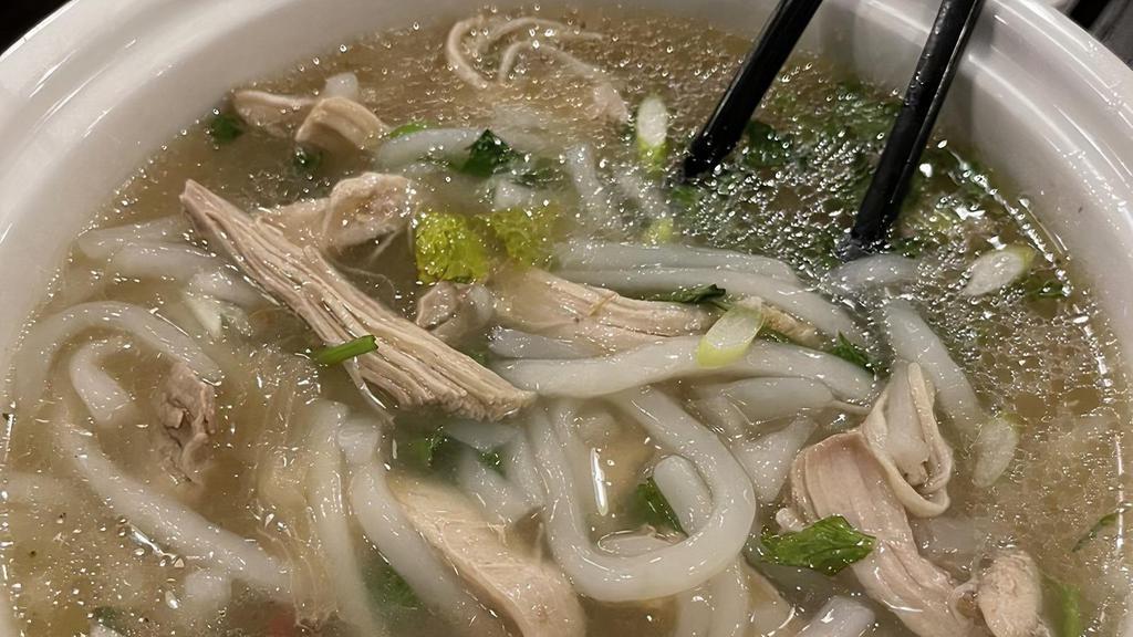 Kow Piek (Noodle Soup) · Freshly made rice noodles served with boiled herb chicken garnished with cilantro, green onions and bean sprouts.