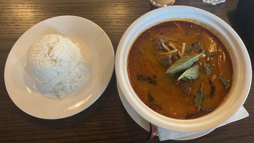 Red Curry · Choice of protein in Thai red curry simmered with herbs. spices and coconut milk, mixed with bamboo shoots and Thai basil. Chicken, Beef, Pork or Veggies. Add shrimp for an additional charge.