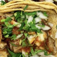 Tacos · Served with onions and cilantro or lettuce and tomato.