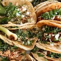 Charola De Tacos (Taco Tray) · 20 tacos, your choice of meat with cilantro and onion or lettuce and tomatoes, salsas includ...