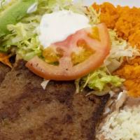 Milanesa De Res O Pollo · Breaded steak or chicken. Served Rice, Beans & Salad 6 Tortillas