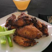 Oven Roasted Jumbo Wings · 10 pc Wings Hand-tossed with your choice of No Sauce, BBQ, Hot, Mild or Honey Sriracha, garn...