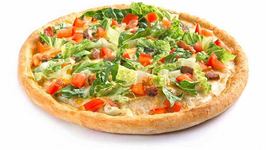 Blt Pizza · Mayonnaise, smoked bacon, mozzarella cheese, baked in the oven, and then loaded with fresh lettuce and tomatoes.