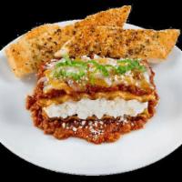 Baked Lasagna · Served with personal garlic bread and Parmesan cheese.
