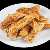 Cheesy Bread · Oven-baked bread sticks glazed in rich garlic butter and oregano and covered in a thick laye...