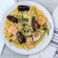 Fettuccine Di Amalfi. · Chef's choice. Mussels, clams, and shrimp in a garlic-butter wine sauce.