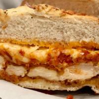 Chicken Parmigiana · Breaded chicken breast, baked mozzarella cheese, house red sauce.