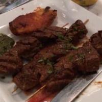 Anticuchos O Anticuchos De Pollo · Three skewer of beef heart or chicken marinated in andean dry peppers, char-grilled and serv...