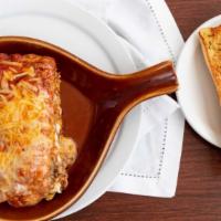 Lasagna · Our famous homemade lasagna with meat and 3 cheeses, topped with marinara sauce.