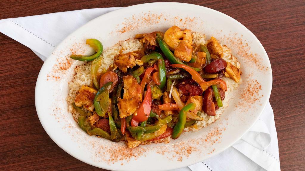 Jambalaya · Shrimp, Chicken, Kielbasa, Onions, Bell Peppers, in a Cajun Sauce. Served over rice