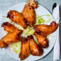 Fried Chicken Wings (Whole) (4 Pc) · Marinated in our home made Ginger Soy Sauce