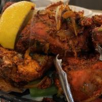 Tandoori Chicken Half (4 Pieces) · Chicken marinated overnight in our homemade yogurt with herbs, ginger, garlic and spices and...
