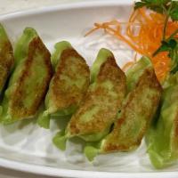 Vegetable Gyoza · Pan fried vegetable dumplings.