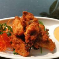 Fried Chicken Wings(6Pcs) · Deep Fried Chicken Wings, Served with house special sauce