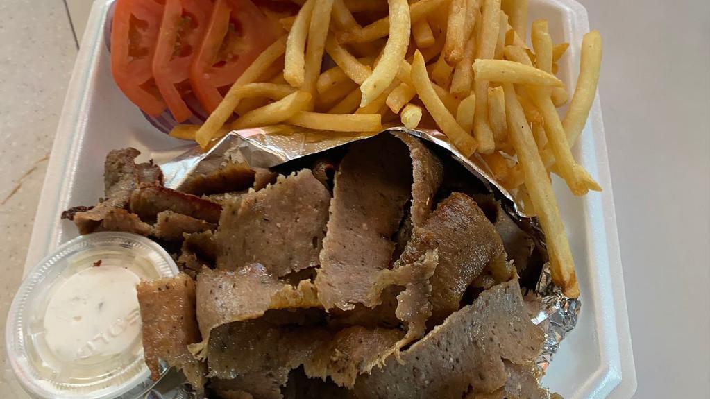 Gyros Plate · Best gyros slowly cooked on a spit with extra meat served with tzatziki sauce, onion, tomatoes, a toasted pita and fries.