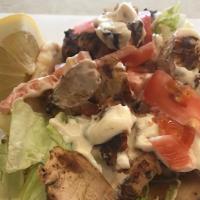 Grill Chicken On Pita · Char-broiled marinated chicken breast tzatziki sauce, lettuce and tomatoes.