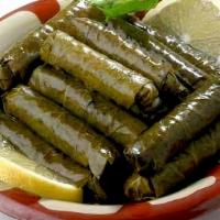 Grape Leaves (4) · Grape leaves filled with rice, tomatoes, parsley, onions, salt, spices, lemon juice, and oli...