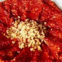 M'Hammara · Slow-roasted red peppers pureed with garlic, spices, salt, and olive oil, topped with crushe...