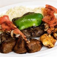 Combo Kabob Plate · Shish kabob, kafta kabob, and shish taouk grilled and topped with bewaz bread served with gr...