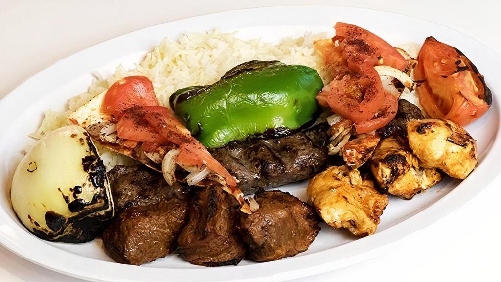 Combo Kabob Plate · Shish kabob, kafta kabob, and shish taouk grilled and topped with bewaz bread served with grilled vegetables, basmati rice, and pita bread.