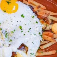 Poutine & Two Look’N At Ya · House-made Brown Gravy, French Fries. Cheese Curds, Eggs Sunny Side Up