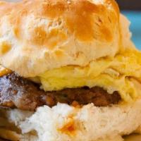 Sausage Biscuit · Flaky Buttermilk Biscuit, Sausage, Egg, Smoked Cheddar, & Pepper Jelly