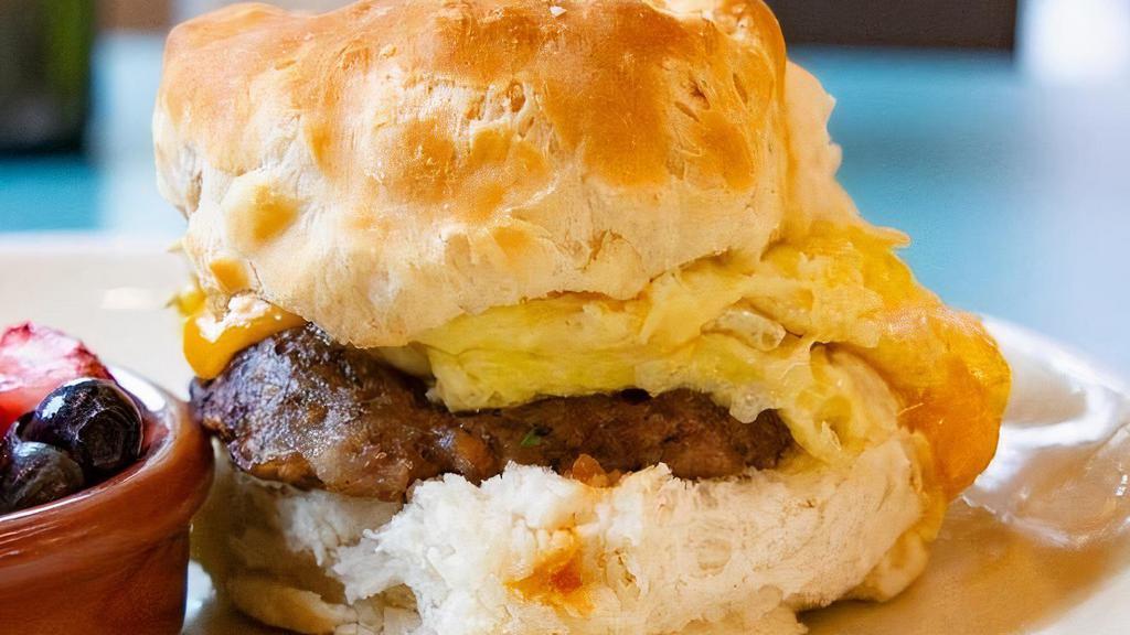 Sausage Biscuit · Flaky Buttermilk Biscuit, Sausage, Egg, Smoked Cheddar, & Pepper Jelly