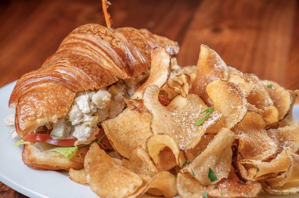Poached Chicken Salad On Croissant · Poached chicken, roasted celery, Granny Smith apples, tomato and red leaf lettuce