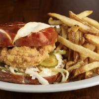 Southern Fried Chicken Sandwich · Southern style fried chicken breast on a pretzel bun with slaw, pickles and a chipotle aioli