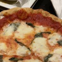 Classic Margherita · San Marzano tomato sauce, basil, evoo and fresh mozzarella cheese